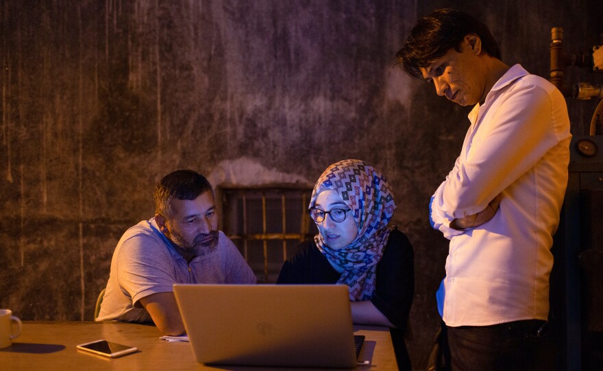 Staff at the Afghanistan Hazaras Culture and Solidarity Organization assist refugees from Afghanistan in Trabzon, Turkey. They estimate at least 35 families have arrived in the city from Afghanistan in the past three months, although the Turkish government says it has blocked more than 40,000 Afghans from crossing through Turkey's borders.