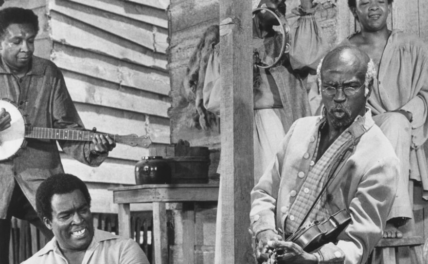 Louis Gossett Jr. (as Fiddler) plays the fiddle in the 1977 miniseries “Roots.”