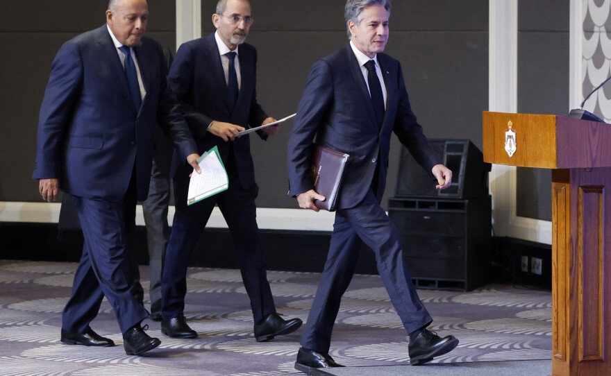 U.S. Secretary of State Antony Blinken, right, Egyptian Foreign Minister Sameh Shoukry, left, and Jordanian Deputy Prime Minister and Foreign Minister Ayman Safadi arrive to attend a press conference in Amman, Jordan, on Saturday.