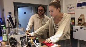 David Alport, owner of the Bridge City Collective marijuana dispensary in Portland, Ore., goes over sales numbers with the store's general manager Cameron Moore,  Sept. 20, 2019. 