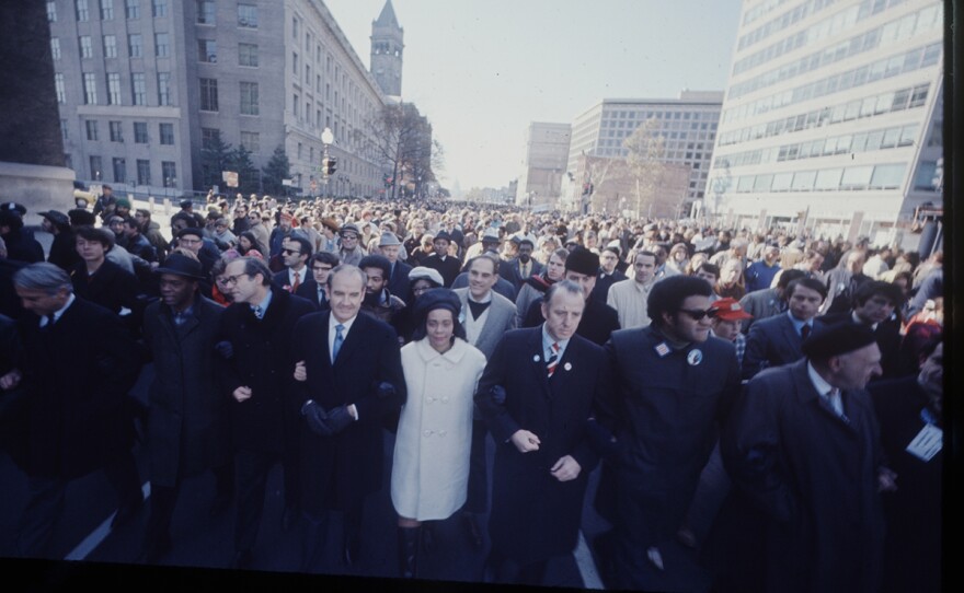 Coretta Scott King in white coat during the Moratorium to End the War in Vietnam March in Washington, DC, United States, 15 Nov. 1969.