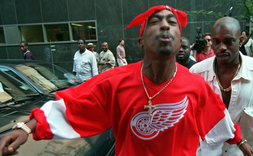 Shakur spits in the direction of reporters as he leaves state Supreme Court in New York, on July 5, 1994.