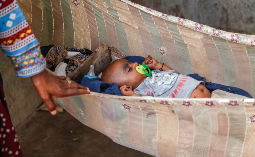 Baby Ladoo's grandmother, Hanifa, rocks the hammock where the 5-month-old stirs. His mother Mariam, 17, says her son was born prematurely at around seven months gestation. She couldn't afford follow-up care, so she bought him home and is hoping for the best. About 1 in 4 babies in this fishing settlement of Rehri Goth are born prematurely, nearly double the national rate of 14% — and that's one of the world's highest. Scientists in a nearby university say they may have uncovered a bacteria that acts as an indicator of whether a women is likely to birth full term or pre-term.