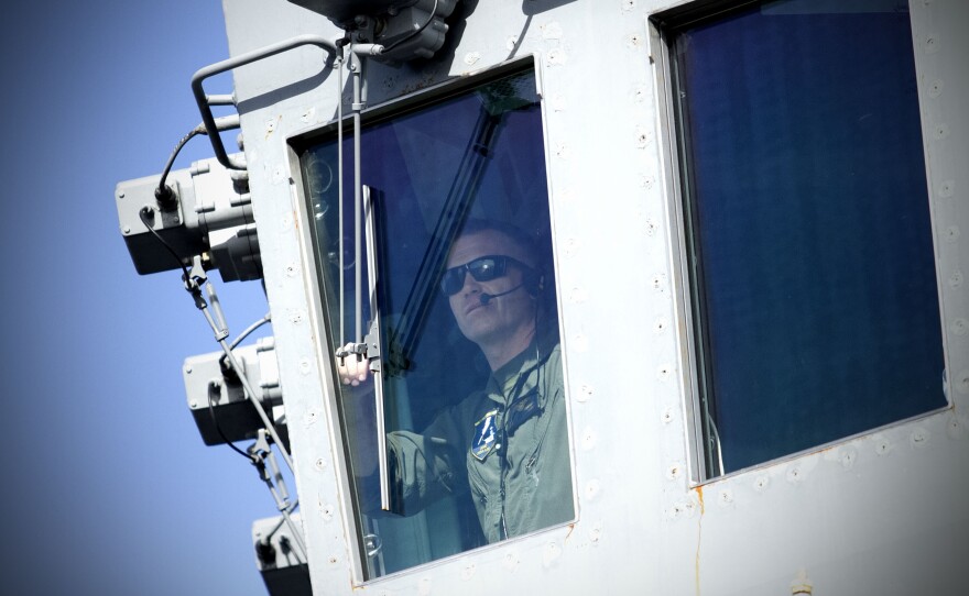 A U.S. Navy flight officer watches flight operations on Nov. 6, 2024 off the coast of San Diego, Calif.