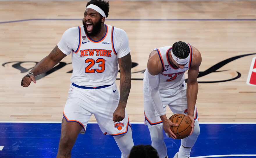 New York Knicks center Mitchell Robinson (23) and guard Josh Hart (3) celebrate after Game 4 of the NBA Finals basketball series against the San Antonio Spurs, Wednesday, June 10, 2026, in New York.