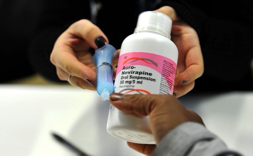 A mother gets antiretroviral drugs at the Chris Hani Baragwanath Hospital in South Africa in May 2012.