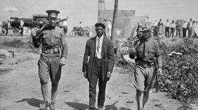 National Guardsman escorting man around the time of a race riot in East St. Louis, June 6, 1917.
