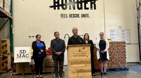 Feeding San Diego CEO Bob Kamensky is shown at the lectern at the Feeding San Diego warehouse on Oct. 1, 2025.
