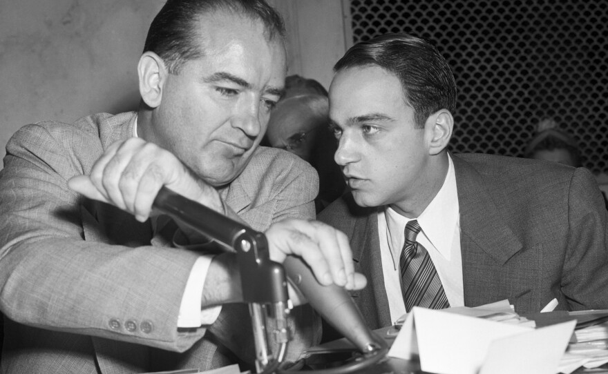 Sen. Joseph McCarthy listens to his attorney, Roy Cohn, during the televised Army-McCarthy hearings in 1954. The series of hearings badly damaged the senator's image and led to a vote of censure by the Senate.