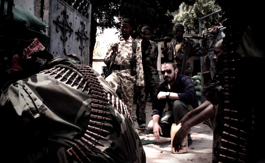 Journalist Jeremy Scahill (with sunglasses) in the documentary, "Dirty Wars/"