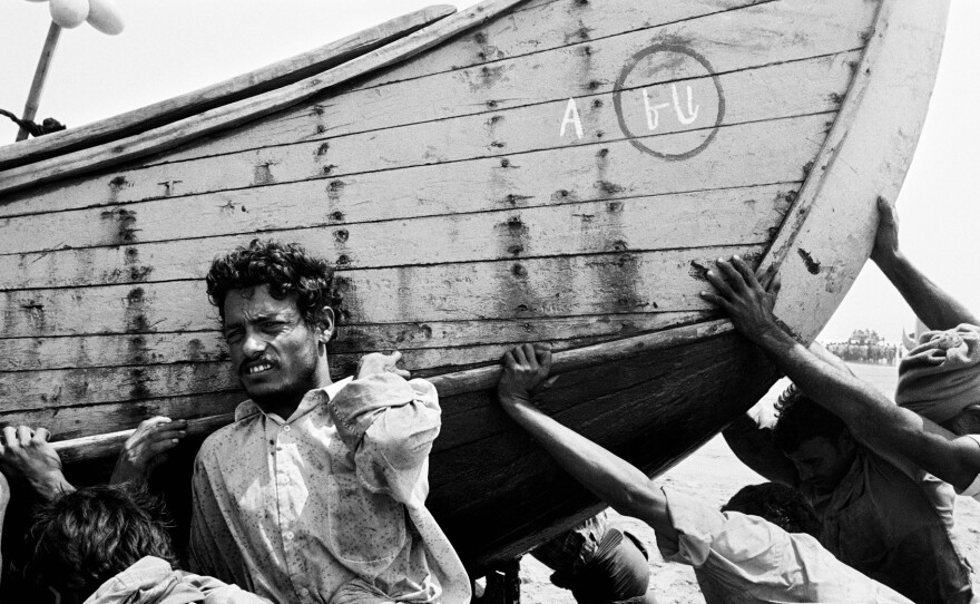 A group of Rohingya men who fled Myanmar to seek a better life in Bangladesh now eke out a living as laborers, Constantine says. He photographed them in 2009.