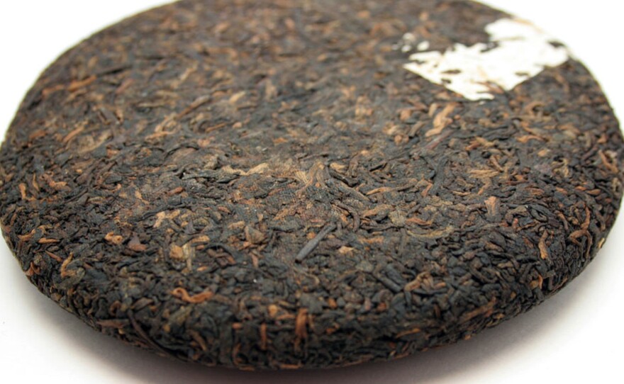 Pu'er is routinely compressed into cakes, called bings, and wrapped in paper printed with the name of the tea.