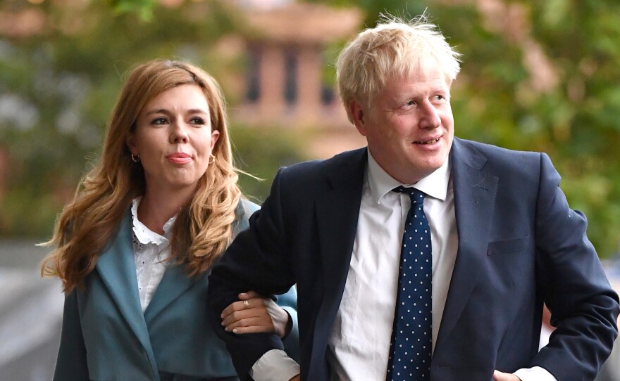 British Prime Minister Boris Johnson and his girlfriend Carrie Symonds at the Conservative Party Conference in 2019. The couple are engaged and expecting their first child.
