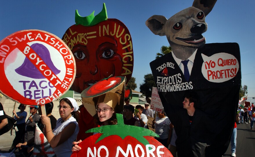 Farmworkers, students and activists march to the corporate offices of Taco Bell in Irvine, Calif., on March 11, 2002, calling attention to the working conditions of Florida farm laborers who harvest tomatoes for the fast-food chain.