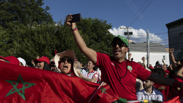 Supporters of Morocco wave flags and cheer during a watch party for the FIFA World Cup match against Brazil in Paterson, N.J. on June 13.