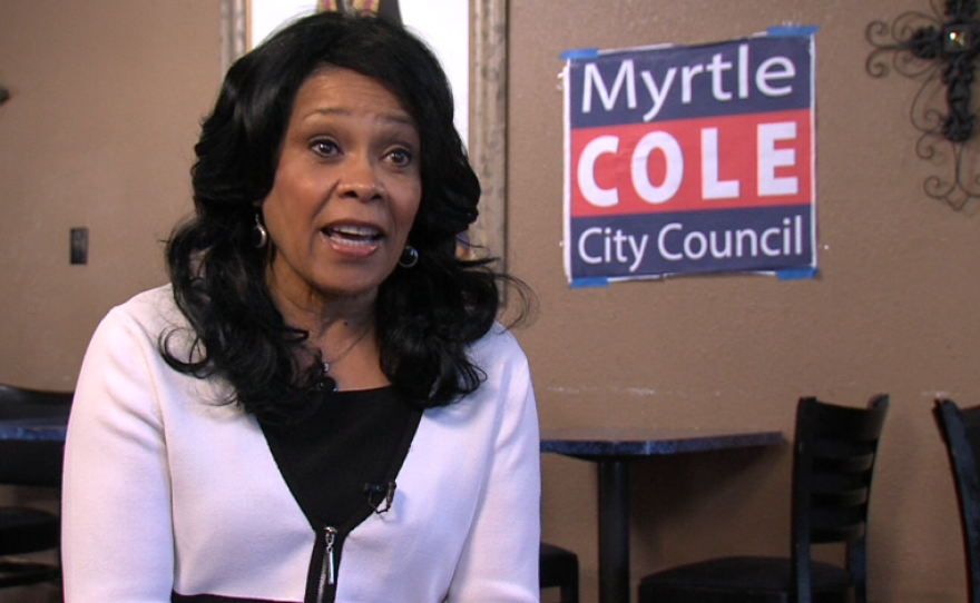 Myrtle Cole talks in her campaign office.