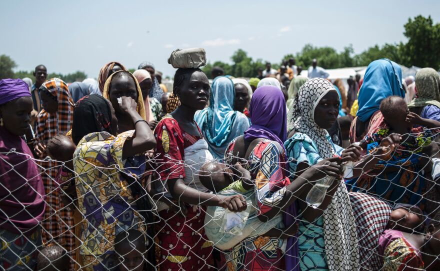 Women and children line up for food in one of the camps for displaced persons in Nigeria. The photo was taken on September 15, 2016.