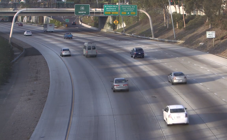 Cars drive through City Heights on northbound Interstate 15, Nov. 24, 2014.