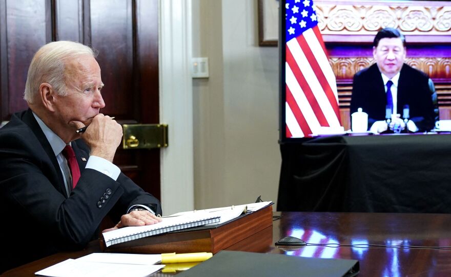 President Biden meets with China's President Xi Jinping during a virtual summit from the Roosevelt Room of the White House in Washington, D.C. on Nov. 15. The White House has been asking other countries to tap their emergency oil stockpiles in a coordinated fashion. China is reportedly considering such a release, though it's not clear if it's responding to the U.S.