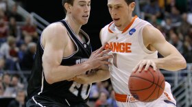 Syracuse's Andy Rautins, right, drives against Butler's Gordon Hayward during the first half of their game in Salt Lake City Thursday night.