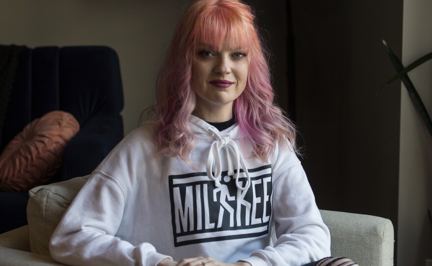 Kara Walla, 29, poses for a portrait in her home in downtown Milwaukee, on Sunday.