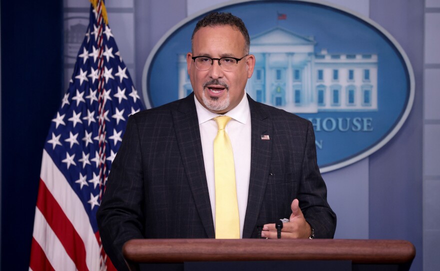 U.S. Education Secretary Miguel Cardona answered questions during a White House press briefing on Thursday.