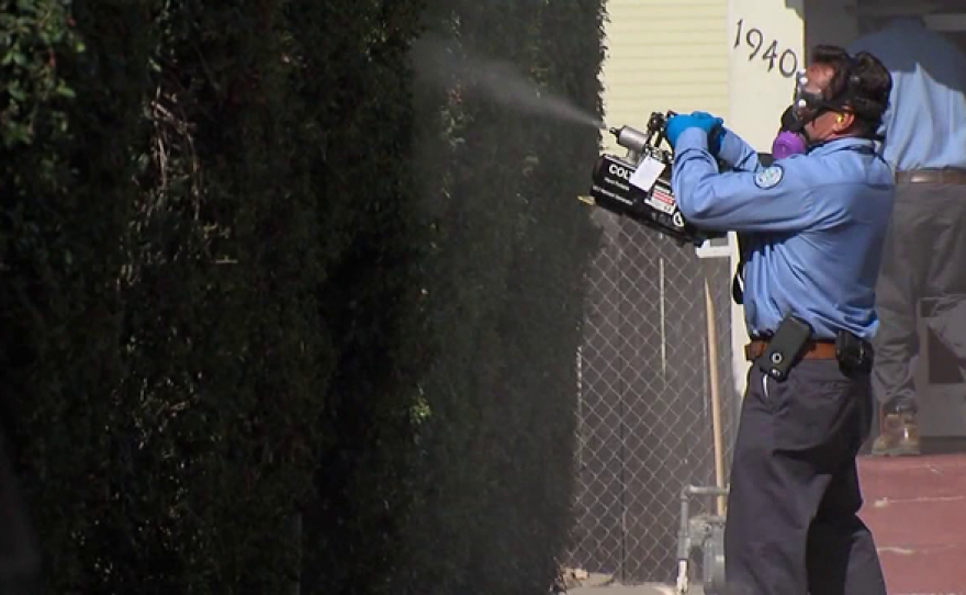 San Diego County Vector Control workers spray pesticide in an effort to kill mosquitoes and prevent the spread of the Zika virus, Sept. 6, 2016.