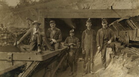Coal miners in front of mine entrance in Red Star, W.Va., 1908.