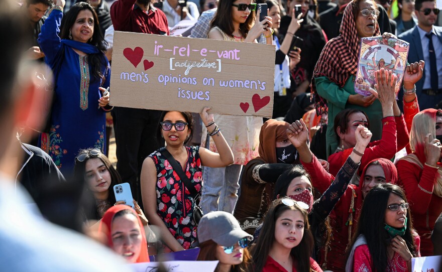 Activists hold placards and chant slogans during a rally to mark International Women's Day in Islamabad.