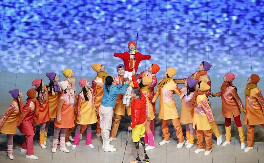 Performers dance during the storytelling component of the opening ceremony.