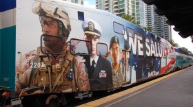 A Coaster train car with a special wrap to honor military members and veterans.