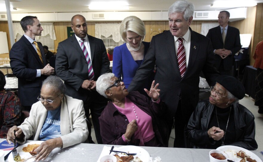 Republican presidential candidate former House Speaker Newt Gingrich, accompanied by his wife, Callista, meets with parishioners during an event Saturday at the Jones Memorial AME Zion Church.
