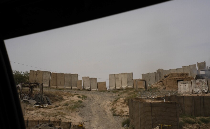 Blast walls can be seen on the roadside while driving on Highway 1 through Wardak province.