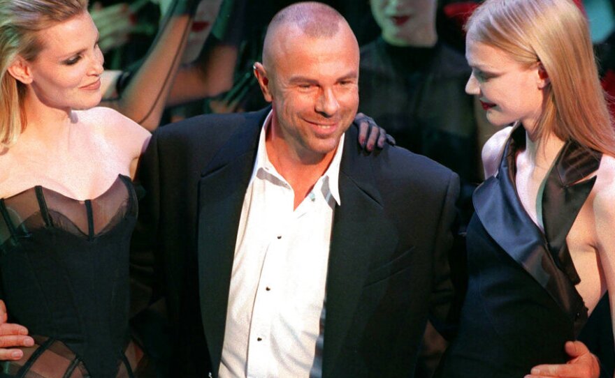 French fashion designer Thierry Mugler on the catwalk with unidentified models after the presentation of his 1998-99 fall-winter ready-to-wear collection presented in Paris on March 15, 1998.