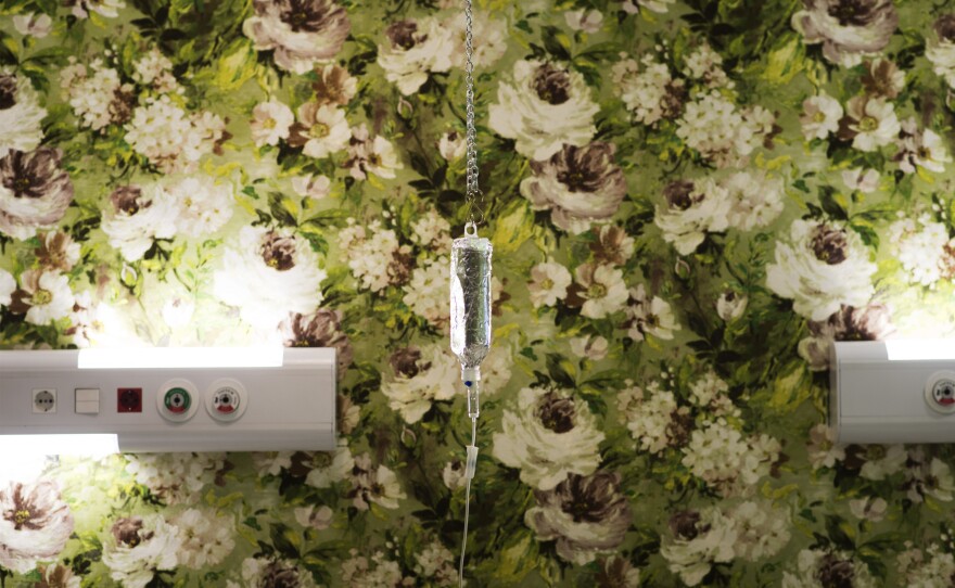 Flowery wallpaper adorns a treatment room at the Roshana Cancer Center. The center is also decorated with statues of angels — because "they save you," one doctor says.