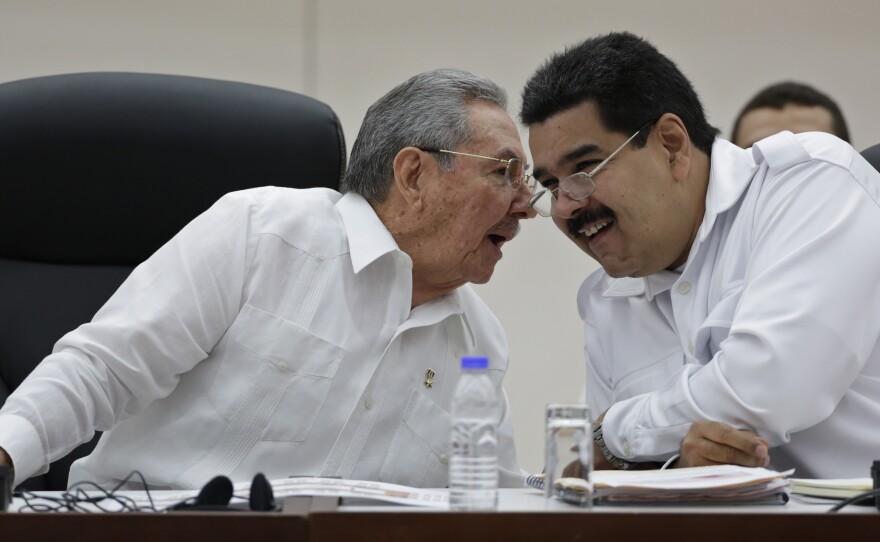 Cuba's President Raul Castro (left) talks to his Venezuelan counterpart Nicolas Maduro at a summit in Havana on Oct. 20. The two countries are close allies that have been highly critical of the U.S. But with the U.S. and Cuba now planning closer ties, Cuba may tone down its anti-American rhetoric.
