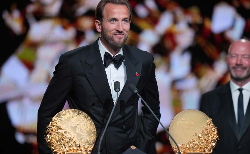 England's soccer player Harry Kane wins the trophy for striker of the year during the Ballon d'Or ceremony at the London Palladium Theatre in London, England, Monday, Oct. 26, 2026 .