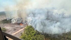 The photo provided by the Office of Gov. Brian Kemp shows smoke produced from a wildfire in Brantley County, Ga., Friday, April 24, 2026.