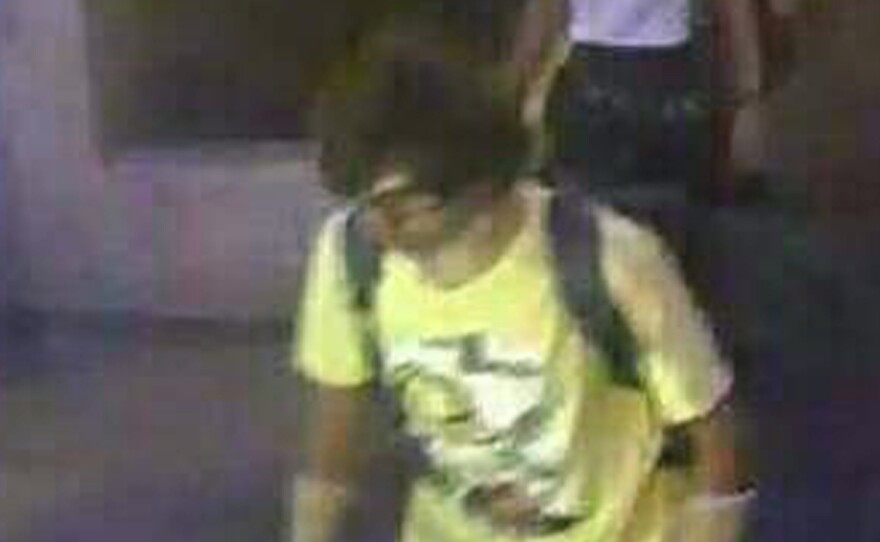 This image, released by the Royal Thai Police shows a man near the Erawan Shrine before an explosion occurred in Bangkok, Thailand, on Monday.