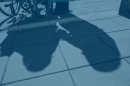 The shadow of a person in a wheelchair and their caregiver is pictured in this undated image.