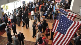 Hundreds of veterans and military spouses meet with prospective employers at the Hiring Our Heroes job fair at Nationals Park in Washington, D.C., in December. Veterans say they're still having trouble finding jobs and getting other types of assistance.