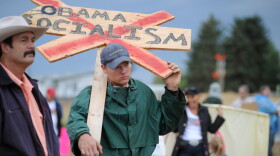 Brian Stern of Belgrade, Montana protests outside a town hall meeting on health care attended by President Barack Obama in a hangar at Gallatin Field Airport August 14, 2009 in Belgrade, Montana. 