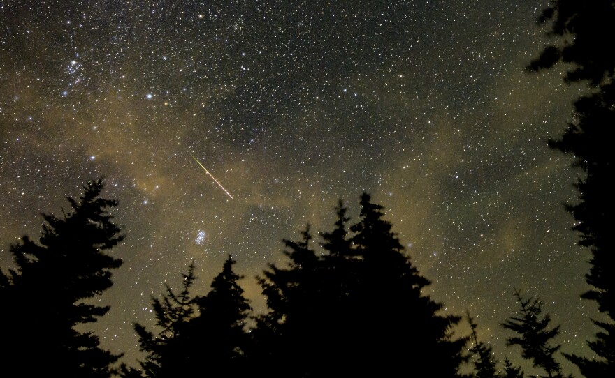 A meteor streaks across the sky during the annual Perseid meteor shower in August 2021 in West Virginia.