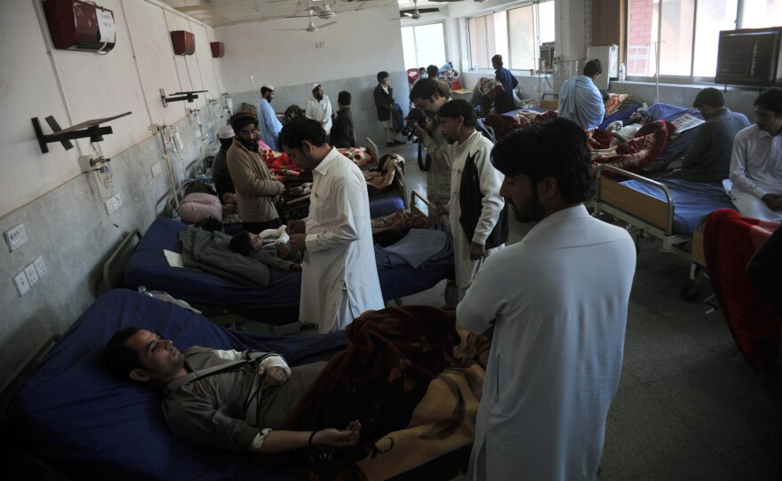 Injured Pakistanis are treated in a hospital in Peshawar on Tuesday.