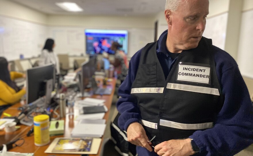 Scripps Health president and CEO Chris Van Gorder wears a vest that says "incident commander" while standing in the Scripps corporate offices, March 12, 2020.