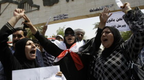 Iraqi demonstrators shout slogans during a weekly protest against corruption, unemployment and poor public services in the war-torn country at Baghdad's Tahrir Square on July 8. Mahmoud Othman, a Kurdish member of Parliament, says it's the Iraqi people who are losing out as a political stalemate continues.