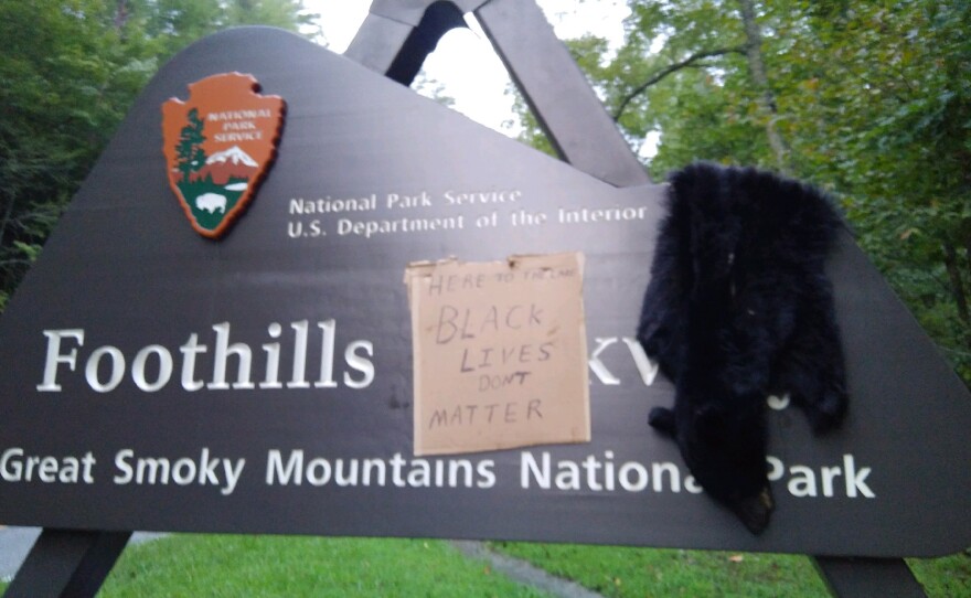An entrance to Great Smoky Mountains National Park in Tennessee was vandalized last weekend with the skin of a black bear and a sign that read "Here To The Lake Black Lives Don't Matter".