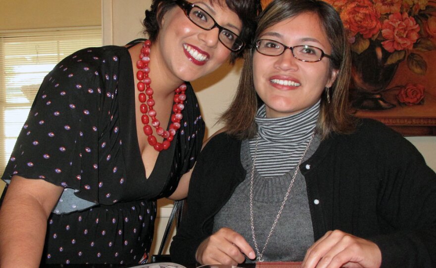 Dolores Arredondo (left) and Alicia Barrera look over their 1991 yearbook from Garfield High School.  "Even if you weren't his student, he would always ask you, 'How're you doing in trig? What’s happening with your grades?'" Arredondo says.