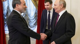 Russian President Vladimir Putin (right) shakes hands with Iranian Foreign Minister Abbas Araghchi during their meeting at the Boris Yeltsin Presidential Library, in St. Petersburg, Russia, Monday.