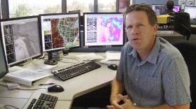 Alex Tardy, warning coordination meteorologist with the National Weather Service San Diego, explains how he monitors weather systems in San Diego at his Rancho Bernardo office, Oct. 2, 2013.
